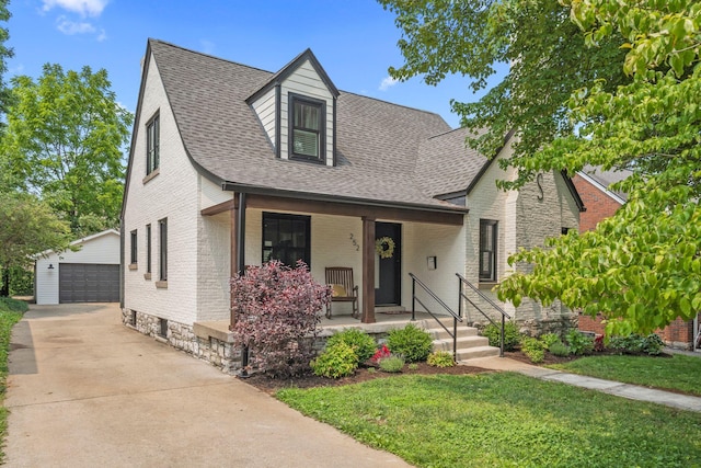 252 Cochran Rd, Lexington, KY 40502 - view of front of house featuring an outdoor structure, a porch, brick siding, and a shingled roof