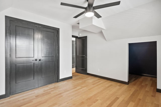 252 Cochran Rd, Lexington, KY 40502 - unfurnished bedroom featuring baseboards, light wood-style floors, a closet, and vaulted ceiling