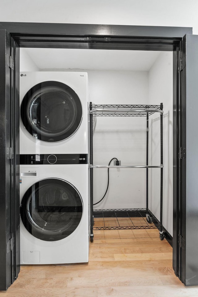 252 Cochran Rd, Lexington, KY 40502 - washroom featuring stacked washer / drying machine and wood finished floors