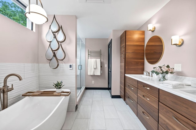 252 Cochran Rd, Lexington, KY 40502 - bathroom featuring double vanity, a freestanding bath, a shower stall, and tile patterned floors