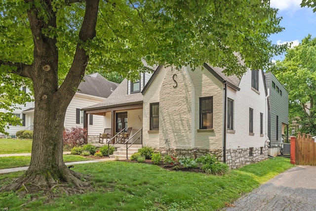252 Cochran Rd, Lexington, KY 40502 - view of front of home featuring a porch, central AC unit, and brick siding