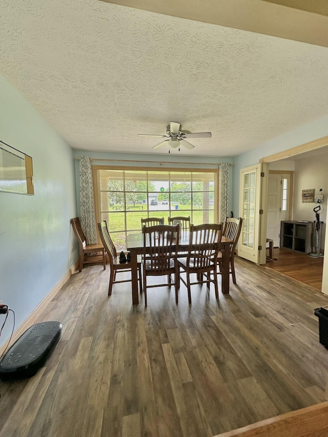 3125 Old Bull Rd, Eubank, KY 42567 - dining area with dark wood-type flooring, a ceiling fan, baseboards, and a textured ceiling