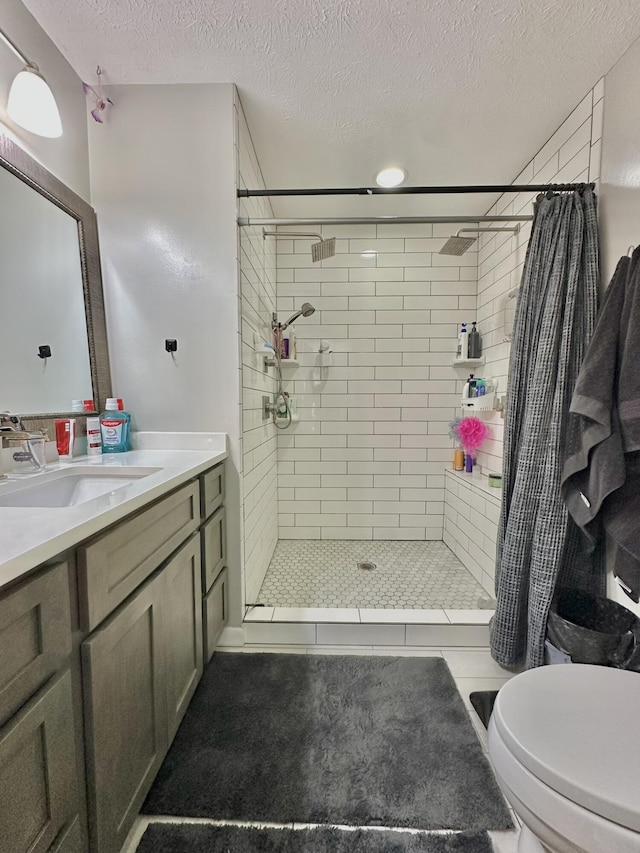 3125 Old Bull Rd, Eubank, KY 42567 - full bathroom featuring a stall shower, a textured ceiling, vanity, and toilet