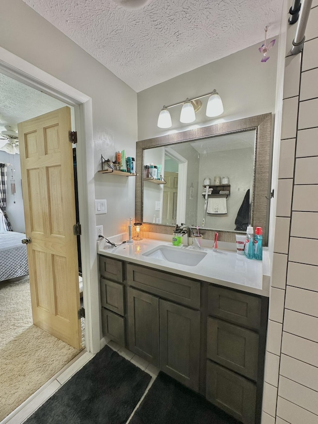 3125 Old Bull Rd, Eubank, KY 42567 - ensuite bathroom featuring vanity, a textured ceiling, tile patterned floors, and ceiling fan