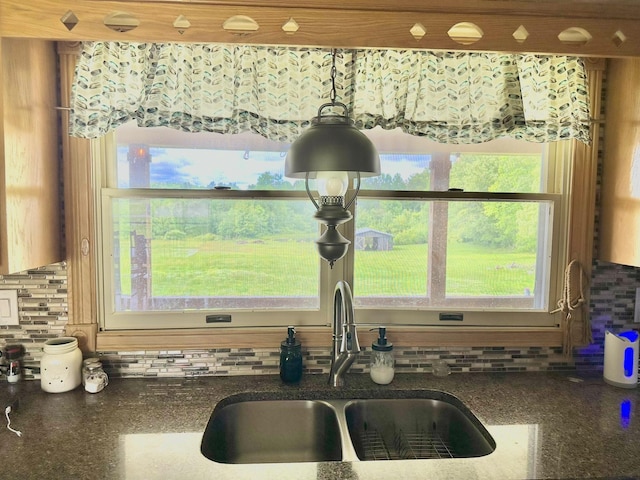 3125 Old Bull Rd, Eubank, KY 42567 - kitchen view of a sink, backsplash, and dark stone counters