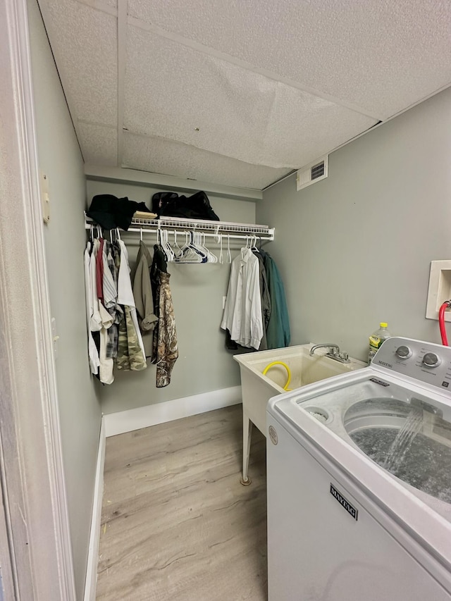 3125 Old Bull Rd, Eubank, KY 42567 - laundry area with washer / dryer, wood finished floors, and baseboards