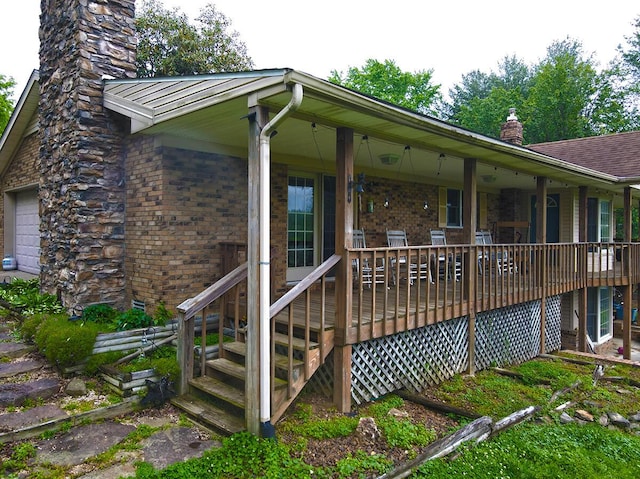 3125 Old Bull Rd, Eubank, KY 42567 - view of property exterior with a chimney, brick siding, and a garage