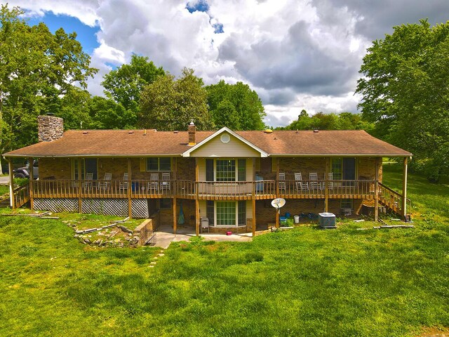 3125 Old Bull Rd, Eubank, KY 42567 - back of property with a chimney, a yard, central air condition unit, a wooden deck, and a patio area