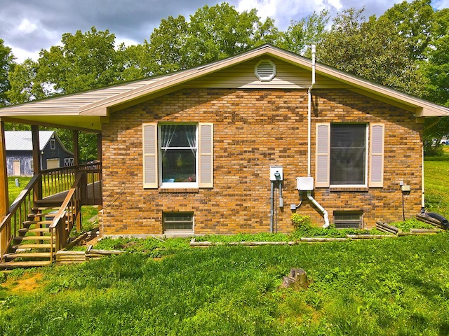 3125 Old Bull Rd, Eubank, KY 42567 - view of property exterior featuring a yard and brick siding