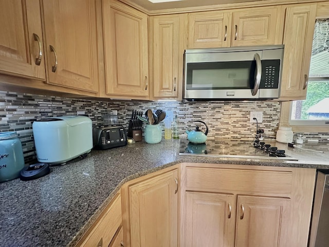 3125 Old Bull Rd, Eubank, KY 42567 - kitchen with stainless steel appliances, light brown cabinetry, backsplash, and dark stone countertops