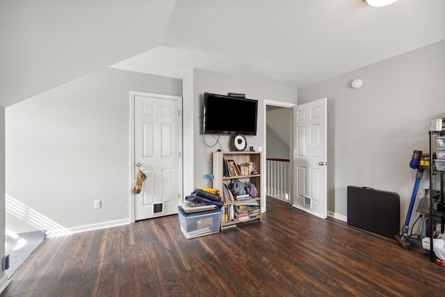 interior space with wood finished floors and baseboards