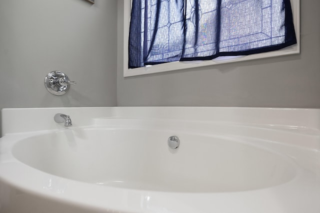 full bath featuring a bath