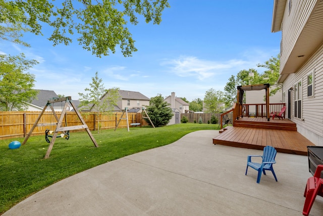 view of patio with a playground, a deck, and a residential view