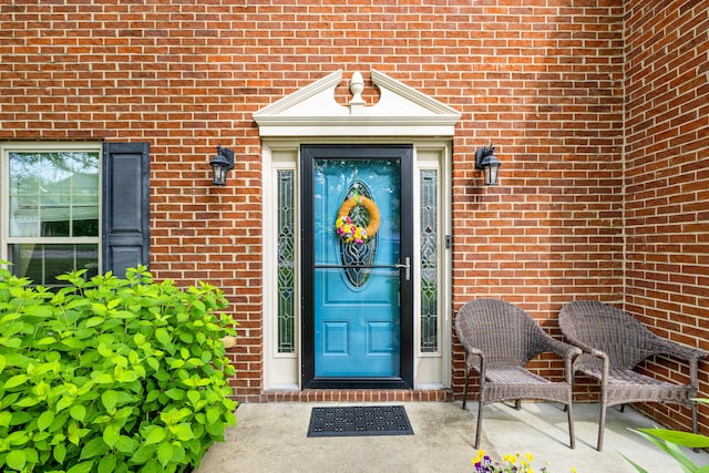 entrance to property with brick siding
