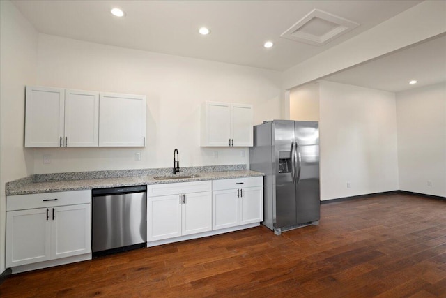 224 Douglas Ave, Versailles, KY 40383 - kitchen with appliances with stainless steel finishes, a sink, dark wood-type flooring, light stone countertops, and white cabinets