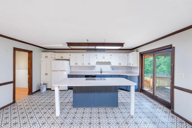 10708 Battlefield Memorial Hwy, Berea, KY 40403 - kitchen featuring freestanding refrigerator, light countertops, white cabinetry, baseboards, and crown molding