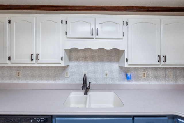 10708 Battlefield Memorial Hwy, Berea, KY 40403 - kitchen featuring a sink, dishwasher, light countertops, and white cabinetry