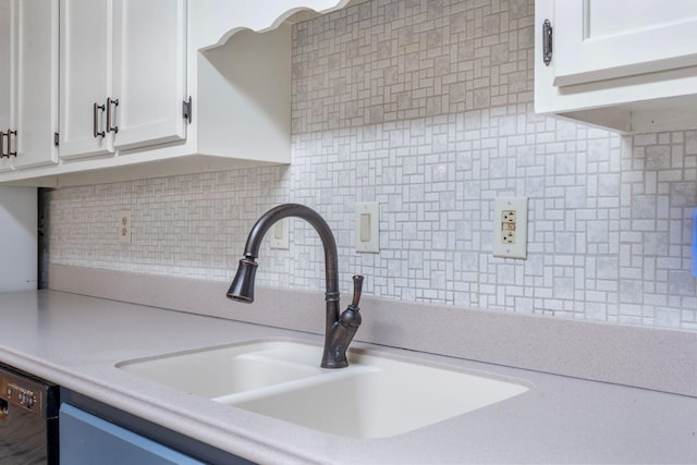 10708 Battlefield Memorial Hwy, Berea, KY 40403 - kitchen featuring a sink, tasteful backsplash, light countertops, white cabinetry, and black dishwasher