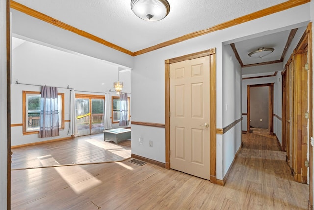 10708 Battlefield Memorial Hwy, Berea, KY 40403 - corridor with light wood-style floors, ornamental molding, baseboards, and a textured ceiling