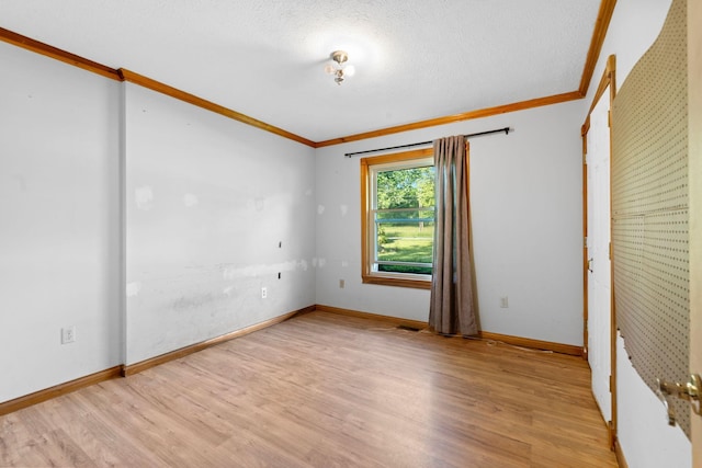 10708 Battlefield Memorial Hwy, Berea, KY 40403 - unfurnished room with crown molding, light wood-type flooring, baseboards, and a textured ceiling