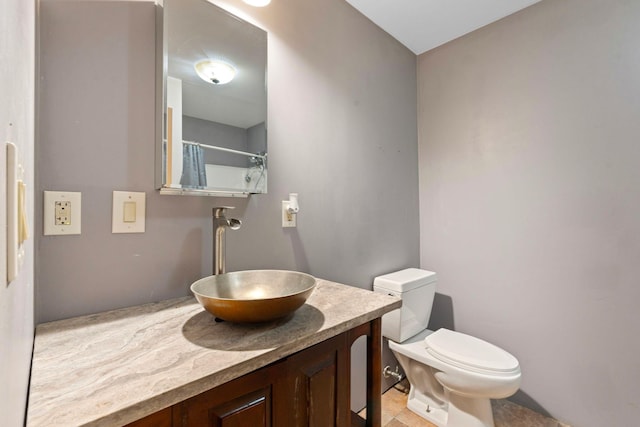 10708 Battlefield Memorial Hwy, Berea, KY 40403 - bathroom with toilet, vanity, and tile patterned flooring