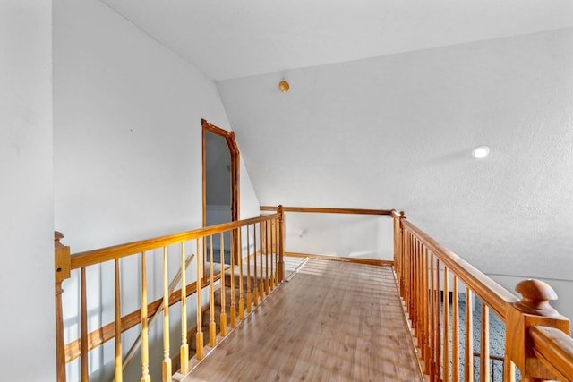 10708 Battlefield Memorial Hwy, Berea, KY 40403 - corridor with an upstairs landing, wood finished floors, lofted ceiling, and baseboards