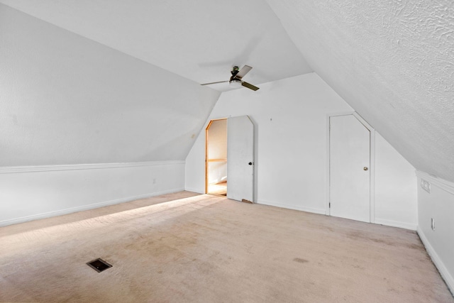 10708 Battlefield Memorial Hwy, Berea, KY 40403 - additional living space featuring carpet flooring, vaulted ceiling, ceiling fan, a textured ceiling, and baseboards