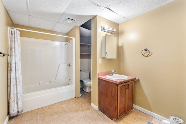 10708 Battlefield Memorial Hwy, Berea, KY 40403 - bathroom with a paneled ceiling, toilet, tile patterned floors, vanity, and shower / bathtub combination with curtain