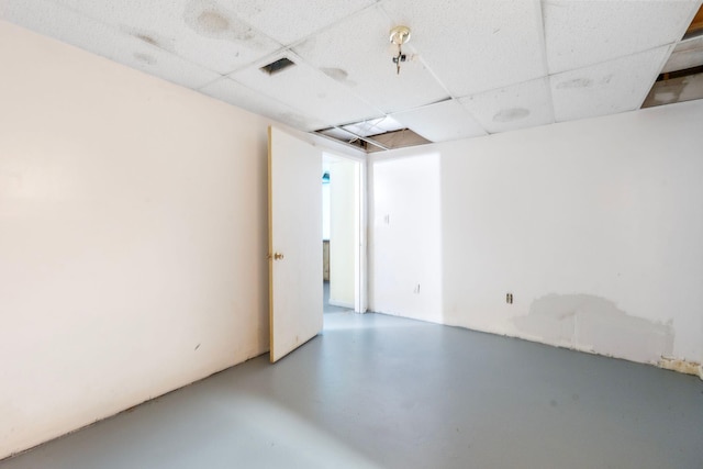 10708 Battlefield Memorial Hwy, Berea, KY 40403 - spare room with a paneled ceiling and concrete floors