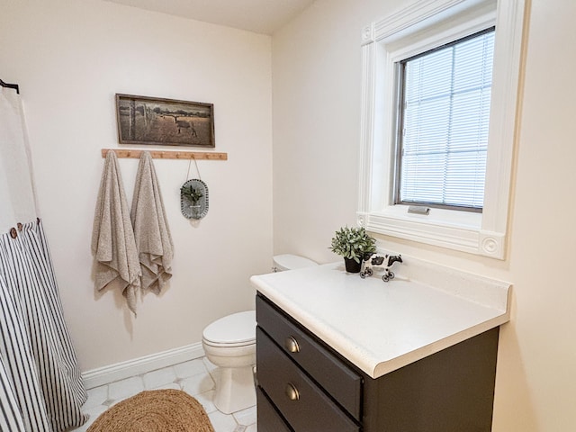 1610 Steele Branch Rd, West Liberty, KY 41472 - full bath with toilet, vanity, baseboards, and a shower with shower curtain