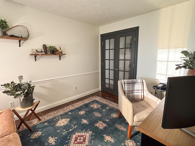 1610 Steele Branch Rd, West Liberty, KY 41472 - home office with french doors, a textured ceiling, baseboards, and wood finished floors