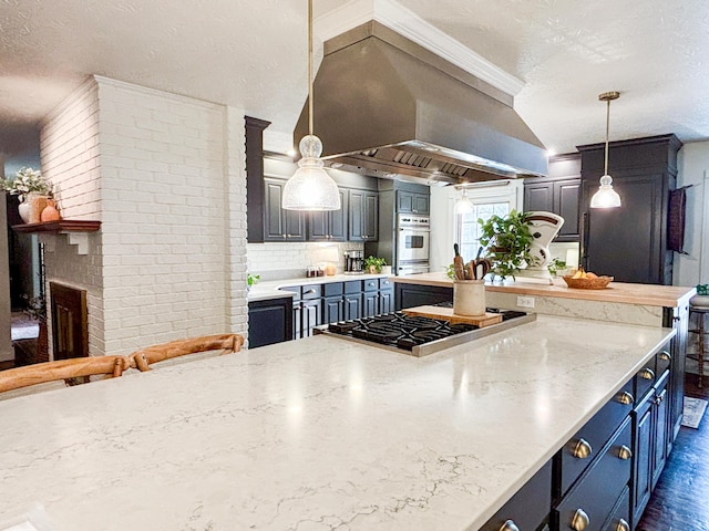 1610 Steele Branch Rd, West Liberty, KY 41472 - kitchen featuring stainless steel gas stovetop, ventilation hood, decorative light fixtures, ornamental molding, and blue cabinetry