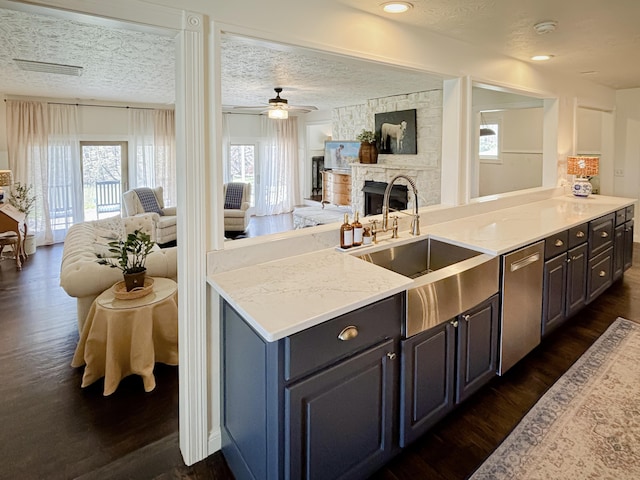 1610 Steele Branch Rd, West Liberty, KY 41472 - kitchen featuring dishwasher, a sink, open floor plan, plenty of natural light, and a textured ceiling