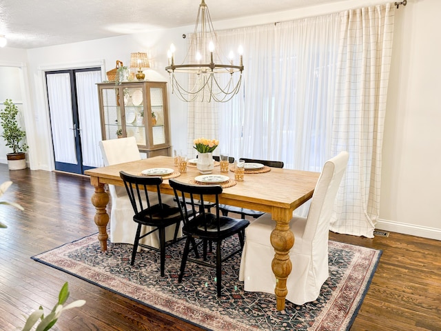 1610 Steele Branch Rd, West Liberty, KY 41472 - dining room featuring dark wood-type flooring, a chandelier, baseboards, and french doors