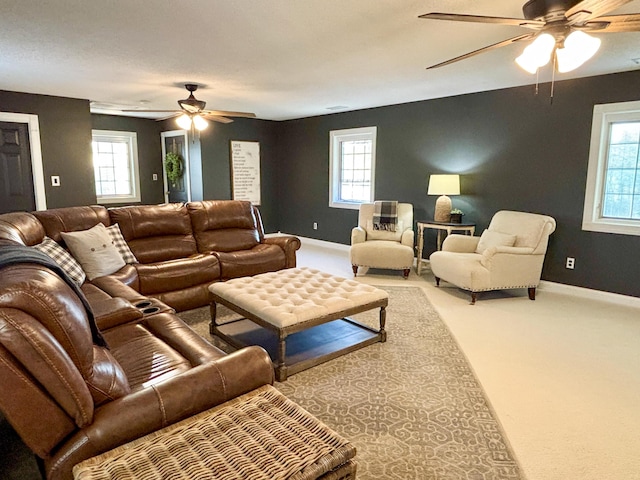 1610 Steele Branch Rd, West Liberty, KY 41472 - carpeted living room featuring a ceiling fan, healthy amount of natural light, and baseboards