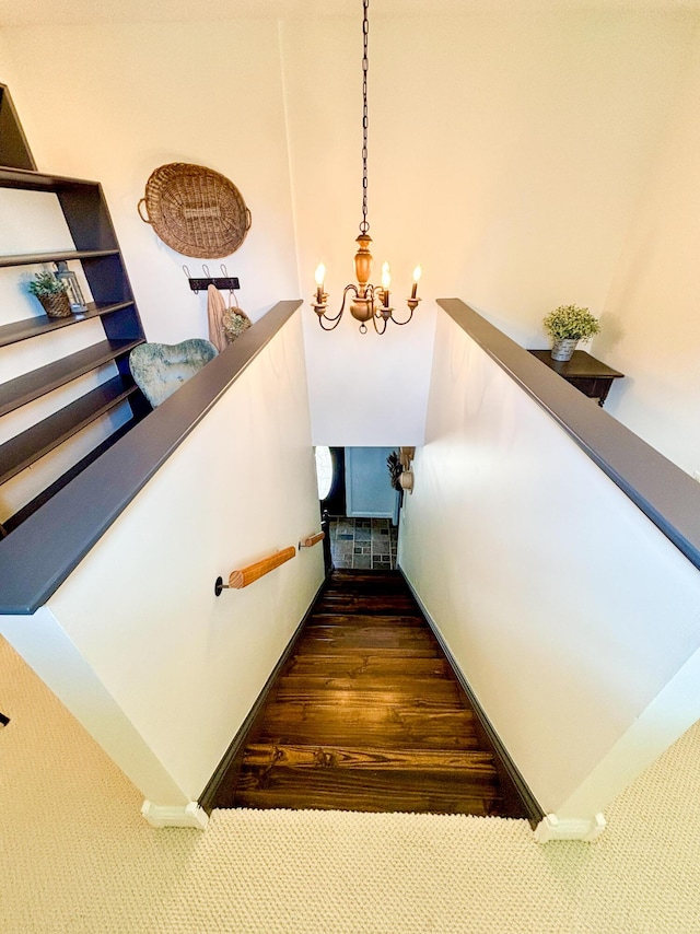 1610 Steele Branch Rd, West Liberty, KY 41472 - stairway with a chandelier and wood finished floors