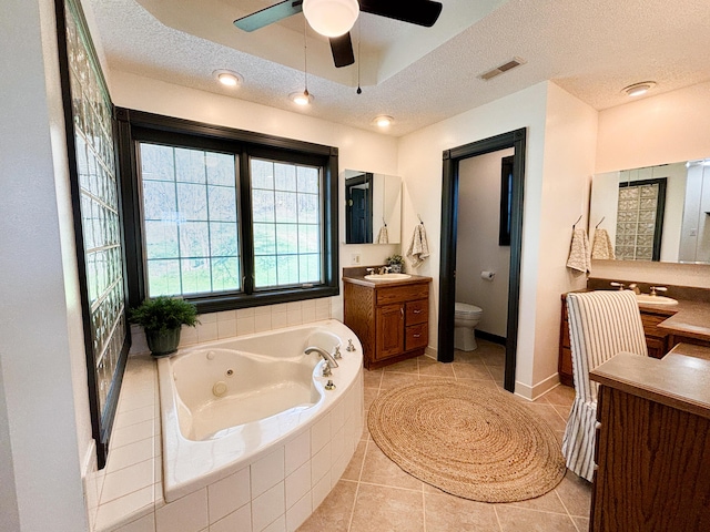 1610 Steele Branch Rd, West Liberty, KY 41472 - full bathroom with a whirlpool tub, vanity, tile patterned flooring, toilet, and ceiling fan