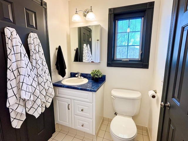 1610 Steele Branch Rd, West Liberty, KY 41472 - bathroom featuring toilet, vanity, tile patterned floors, and baseboards