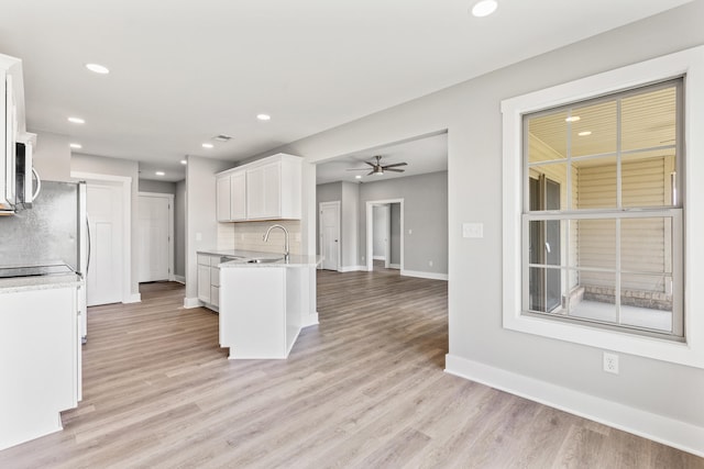 469 Wyldwood Way, Berea, KY 40403 - kitchen with a sink, white cabinets, light wood-style flooring, baseboards, and recessed lighting