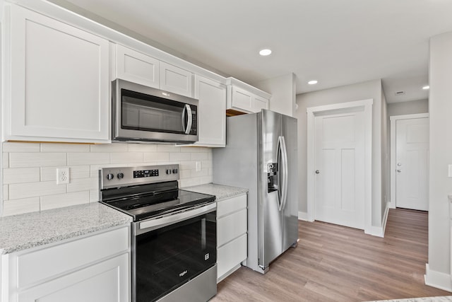 469 Wyldwood Way, Berea, KY 40403 - kitchen featuring stainless steel appliances, white cabinetry, tasteful backsplash, baseboards, and recessed lighting