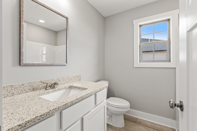 469 Wyldwood Way, Berea, KY 40403 - bathroom with baseboards, toilet, vanity, and wood finished floors