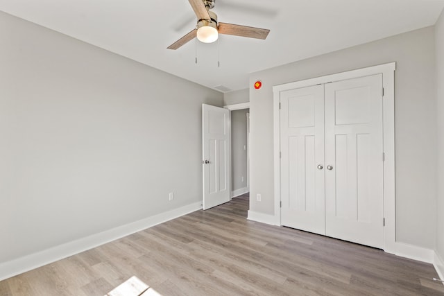 469 Wyldwood Way, Berea, KY 40403 - unfurnished bedroom with light wood-style floors, baseboards, a closet, and ceiling fan