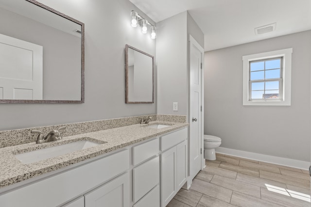 469 Wyldwood Way, Berea, KY 40403 - full bathroom with toilet, baseboards, double vanity, and wood tiled floors