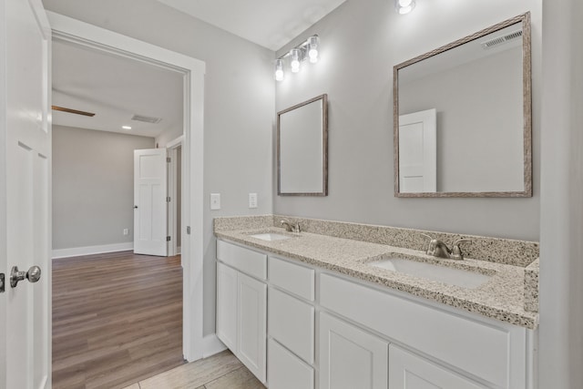 469 Wyldwood Way, Berea, KY 40403 - full bathroom with wood finished floors, double vanity, and baseboards