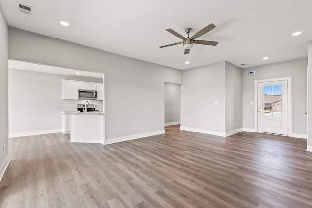 469 Wyldwood Way, Berea, KY 40403 - unfurnished living room with a ceiling fan, wood finished floors, recessed lighting, and baseboards