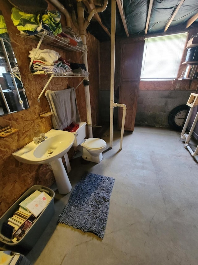 1267 Crab Orchard Rd, Lancaster, KY 40444 - bathroom featuring unfinished concrete flooring, toilet, and a sink