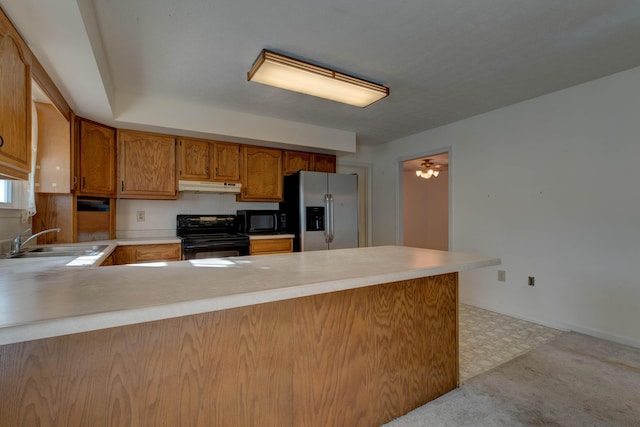 202 Strother St, Mt Sterling, KY 40353 - kitchen featuring black appliances, a sink, under cabinet range hood, a peninsula, and brown cabinetry