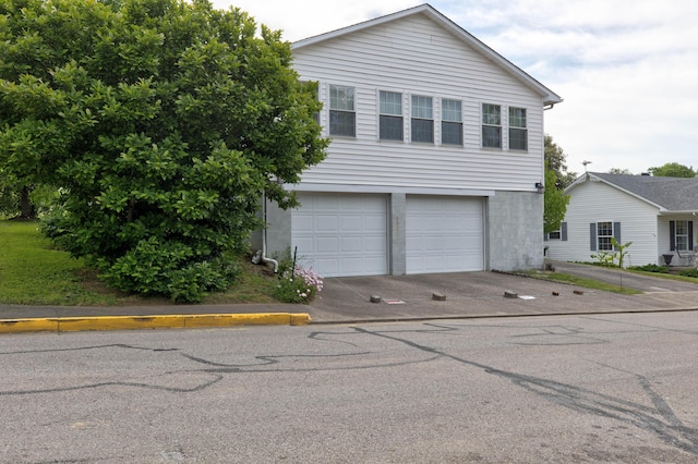 202 Strother St, Mt Sterling, KY 40353 - view of front of property with an attached garage and driveway