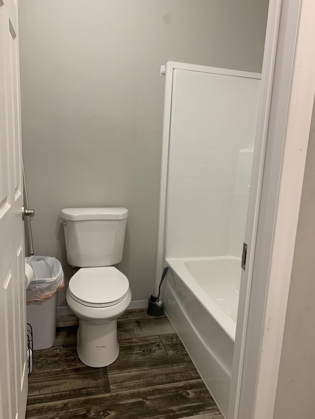 1306 Johnson Rd, Harrodsburg, KY 40330 - full bathroom with toilet, wood finished floors, and a tub to relax in