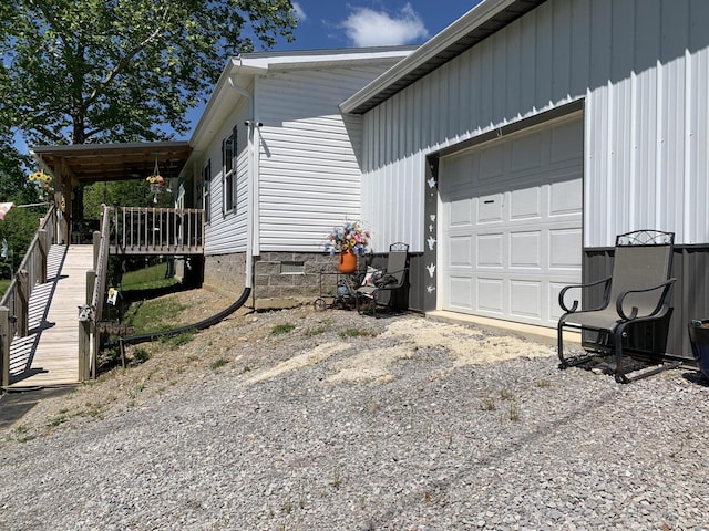 1306 Johnson Rd, Harrodsburg, KY 40330 - view of home's exterior with a garage, crawl space, and dirt driveway